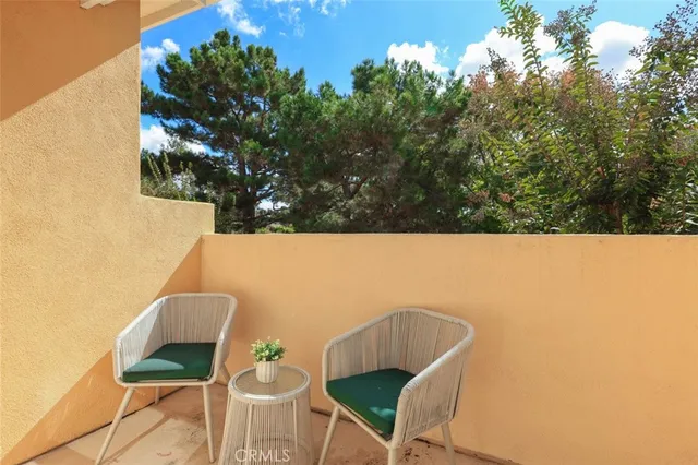 a view of a chairs and table in a patio