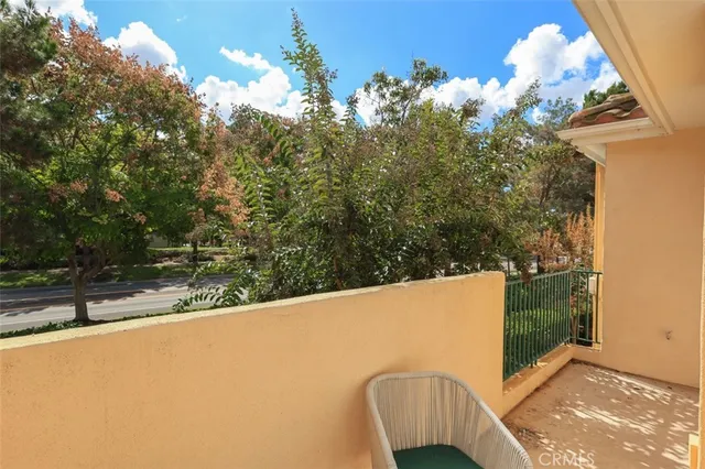 a view of balcony with furniture