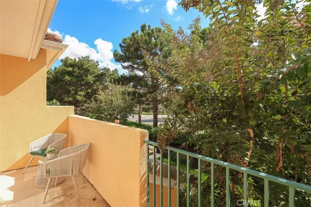 a view of balcony with wooden floor