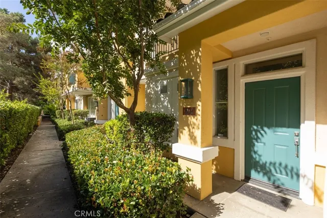 a pathway of a house with a yard