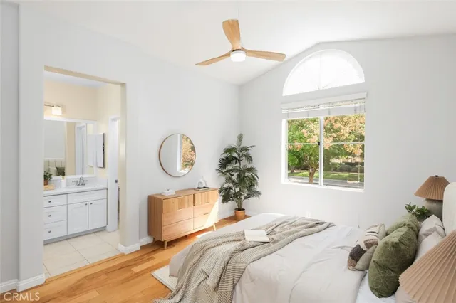 a bedroom with a large bed and a window