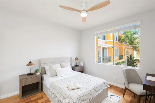 a bedroom with a bed and a chair