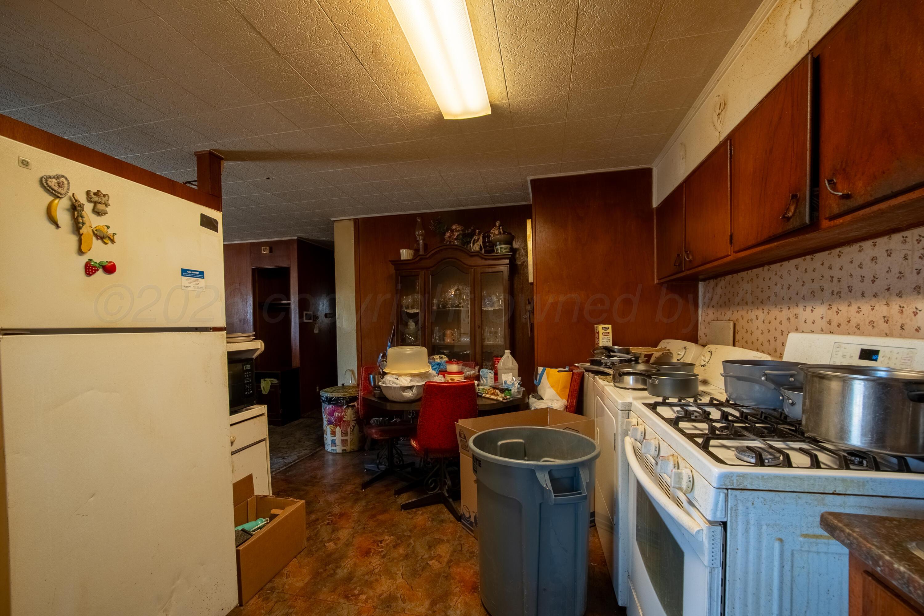3007 Walnut Street Amarillo, TX 79107 - Photo 11 of 21 a kitchen with a refrigerator and a stove