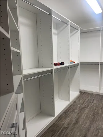 a view of an empty walk in closet