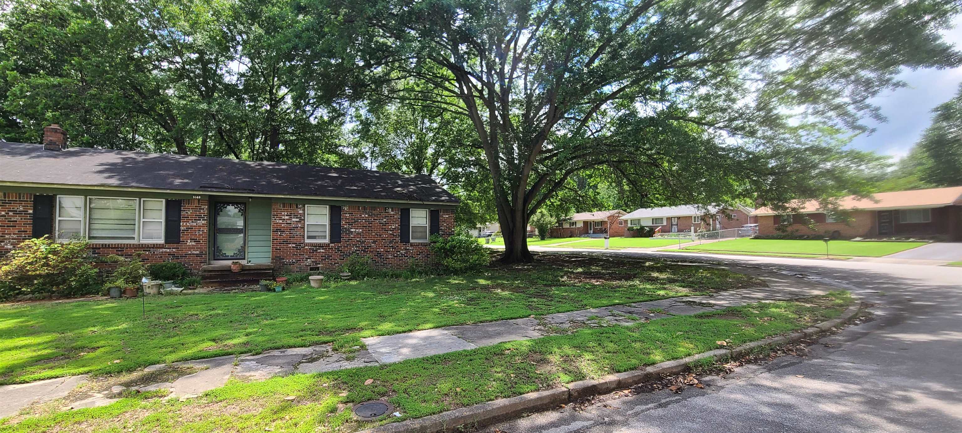 5569 Milam Road Memphis, TN 38120 - Photo 3 of 37 a view of a house with a yard