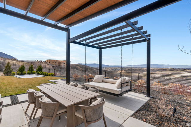 3918 South Mapleton Ests Drive Mapleton, UT 84664 - Photo 79 of 103 Fenced backyard with a pergola, a mountain view, outdoor dining area, and a patio