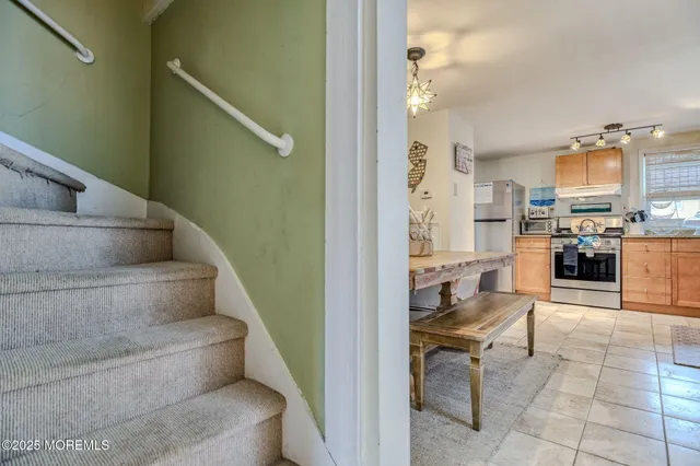 a view of a hallway with living room and furniture