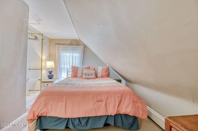 a bedroom with a bed and a mirror