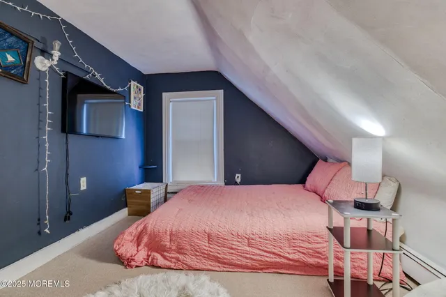 a bedroom with a bed and a chair