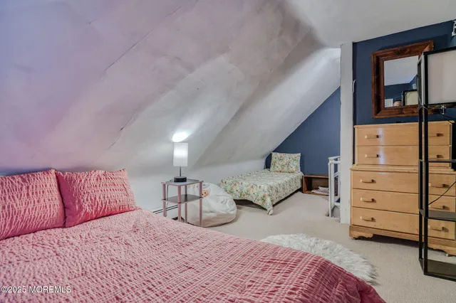 a bedroom with a bed and dresser