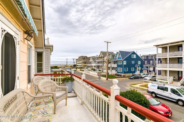 a city view with tall buildings and cars