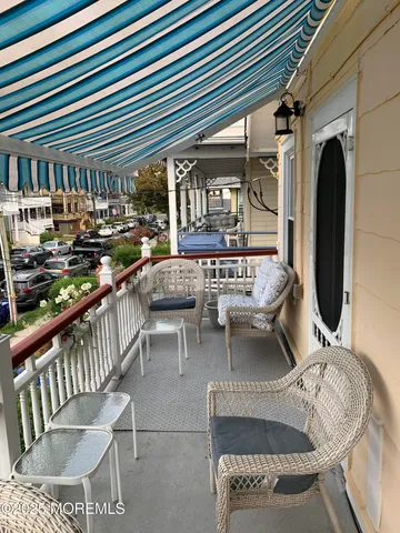 a view of a patio with couches table and chairs