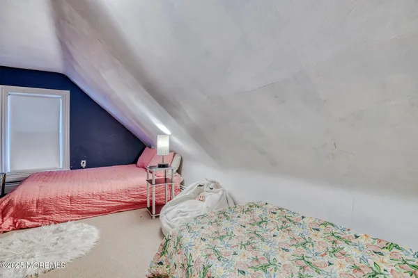 a large kitchen with stainless steel appliances granite countertop a stove a sink dishwasher and cabinets with wooden floor