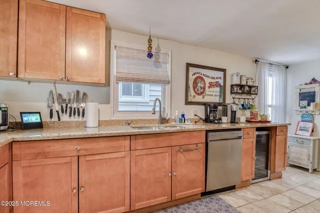 a kitchen with cabinets a sink and appliances