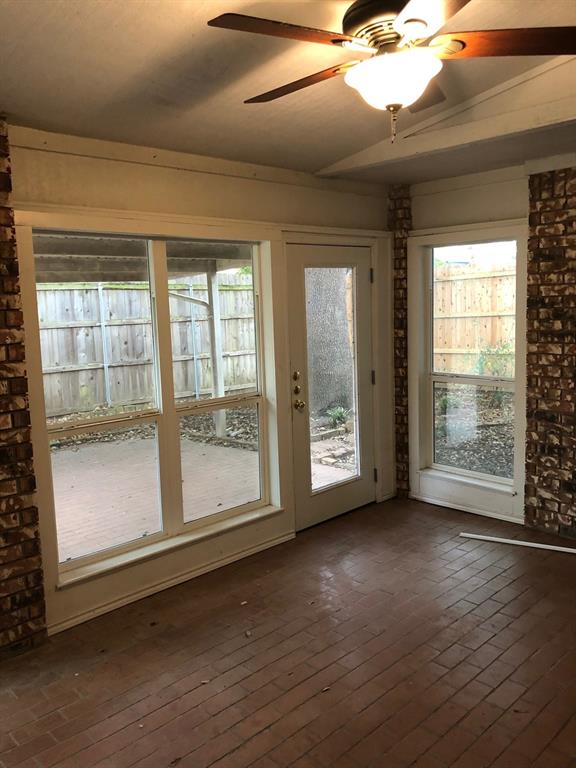 5311 Altacrest Court Grapevine, TX 76051 - Photo 8 of 11 a view of an empty room with wooden floor and a window