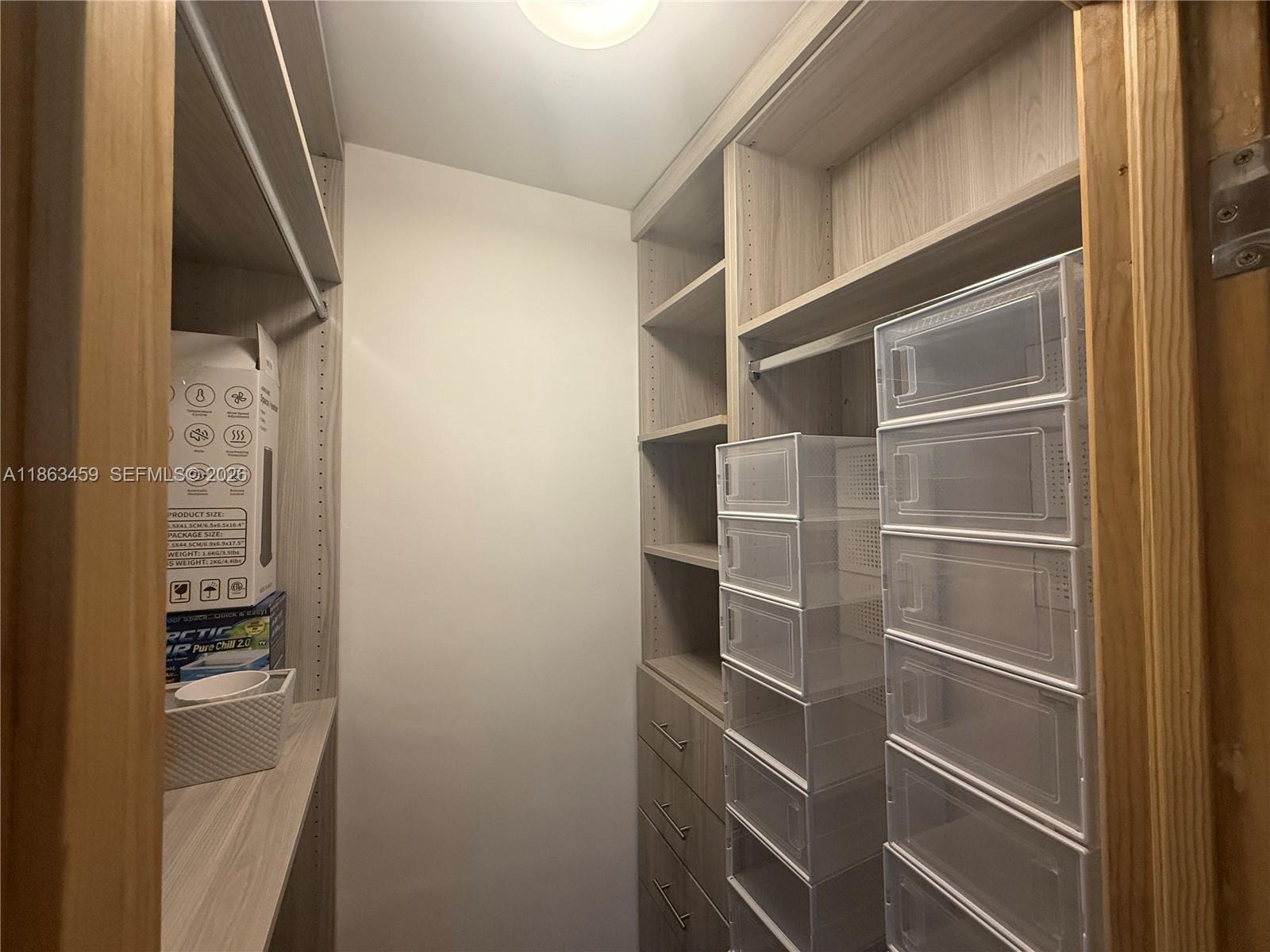 100 Lincoln Road, Unit 1635 Miami Beach, FL 33139 - Photo 15 of 38 a view of walk in closet with empty racks