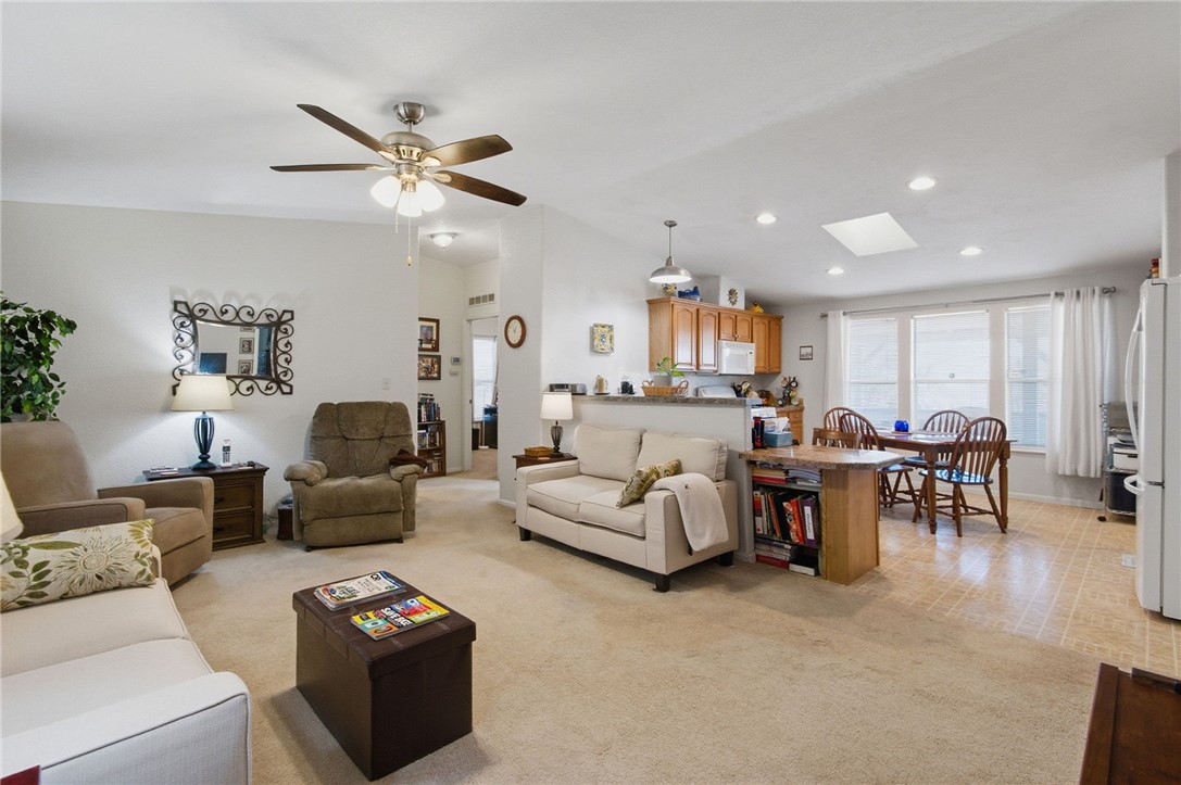 4342 Cordes Road Golden Valley, AZ 86413 - Photo 19 of 39 a living room with furniture and a large window
