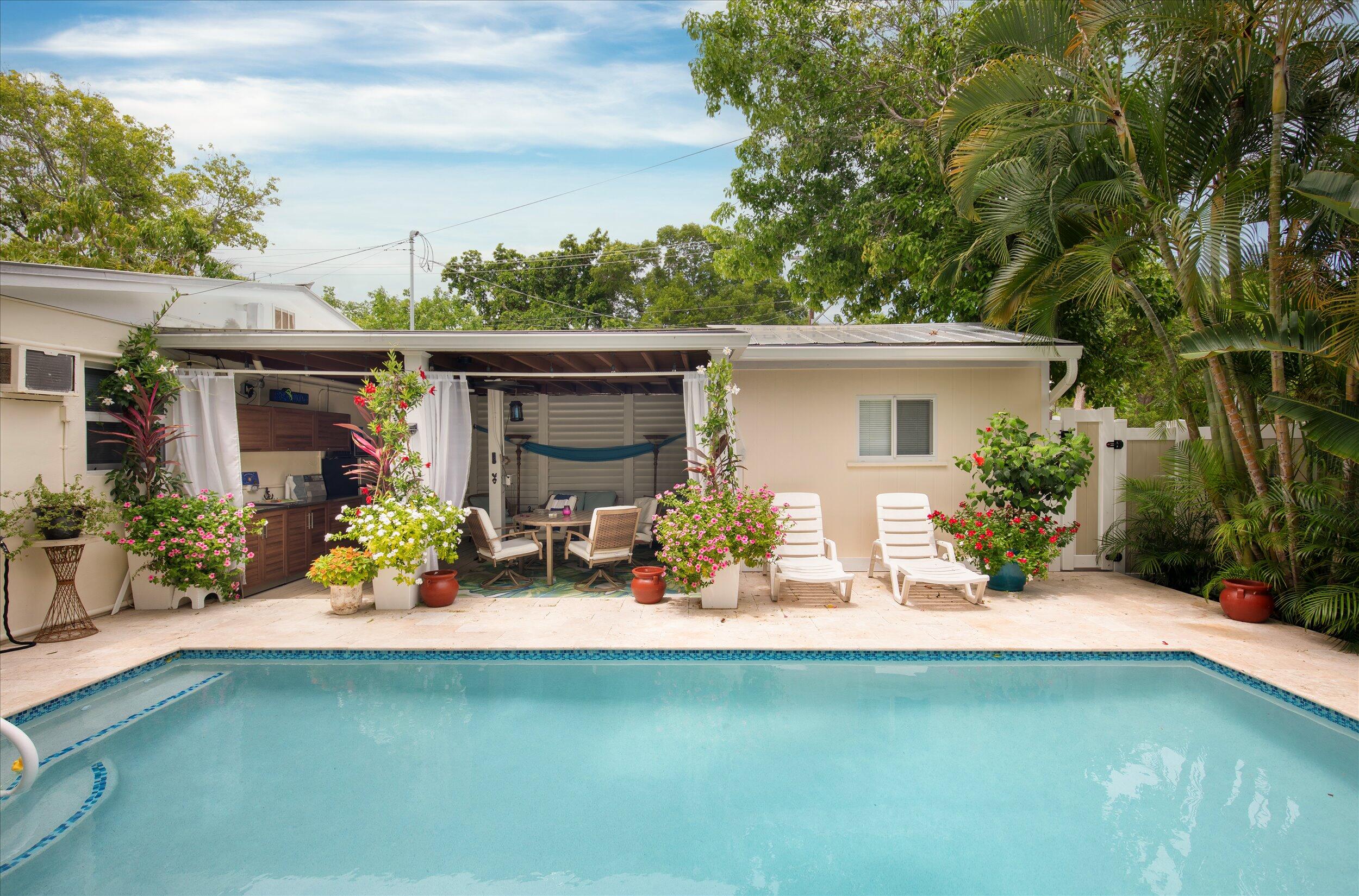 1320 6th Street Key West, FL 33040 - Photo 11 of 61 a view of a house with patio outdoor kitchen