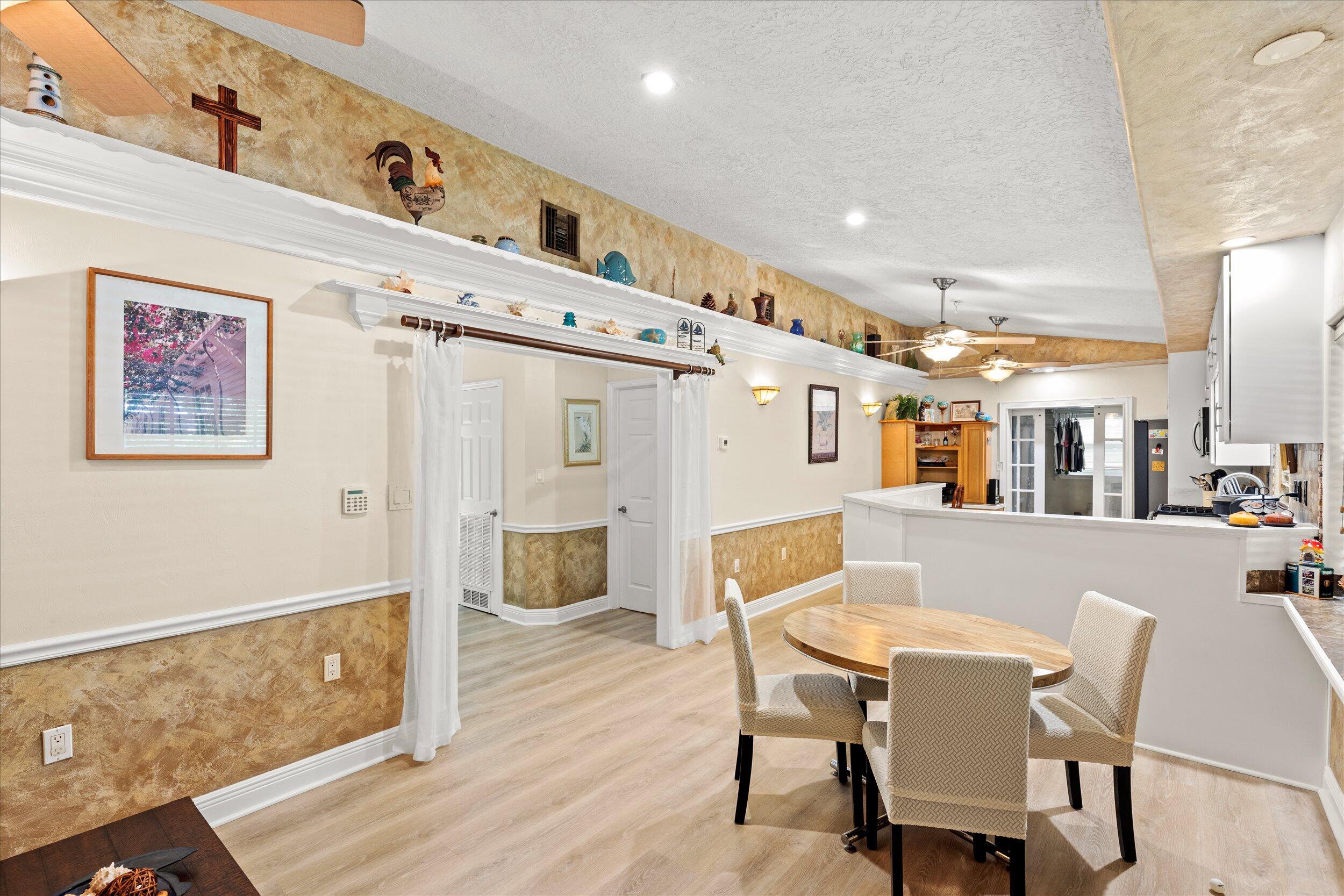 1320 6th Street Key West, FL 33040 - Photo 20 of 61 a dining room with furniture and wooden floor