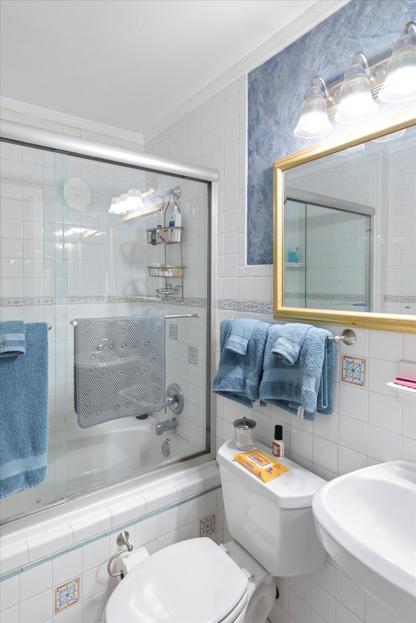 1320 6th Street Key West, FL 33040 - Photo 39 of 61 a bathroom with a bathtub shower sink mirror and toilet