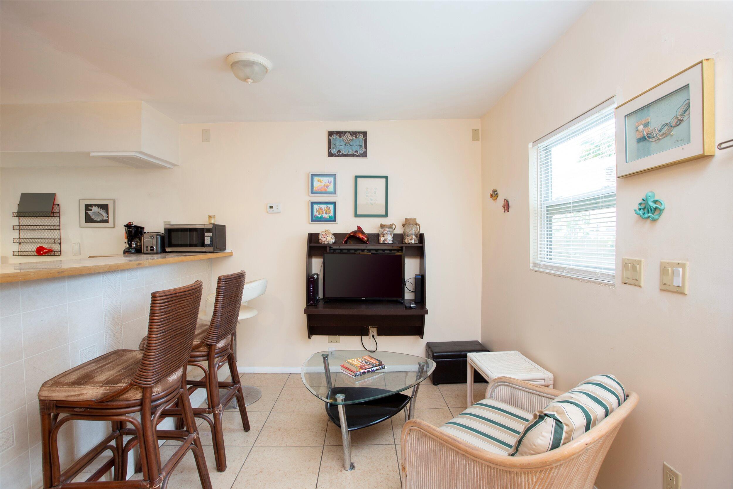 1320 6th Street Key West, FL 33040 - Photo 42 of 61 a living room with furniture and a flat screen tv