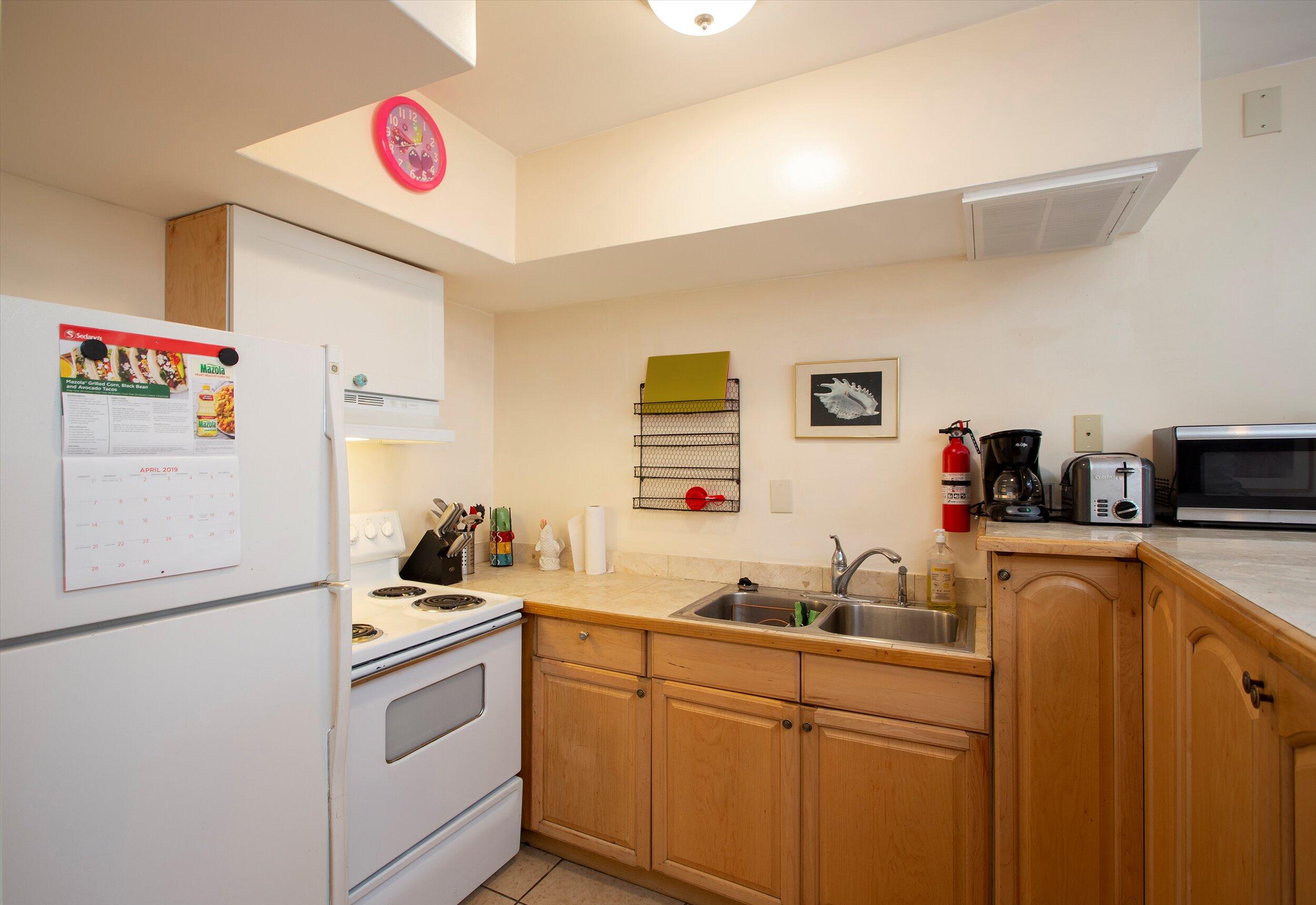 1320 6th Street Key West, FL 33040 - Photo 46 of 61 a kitchen with a refrigerator and a sink