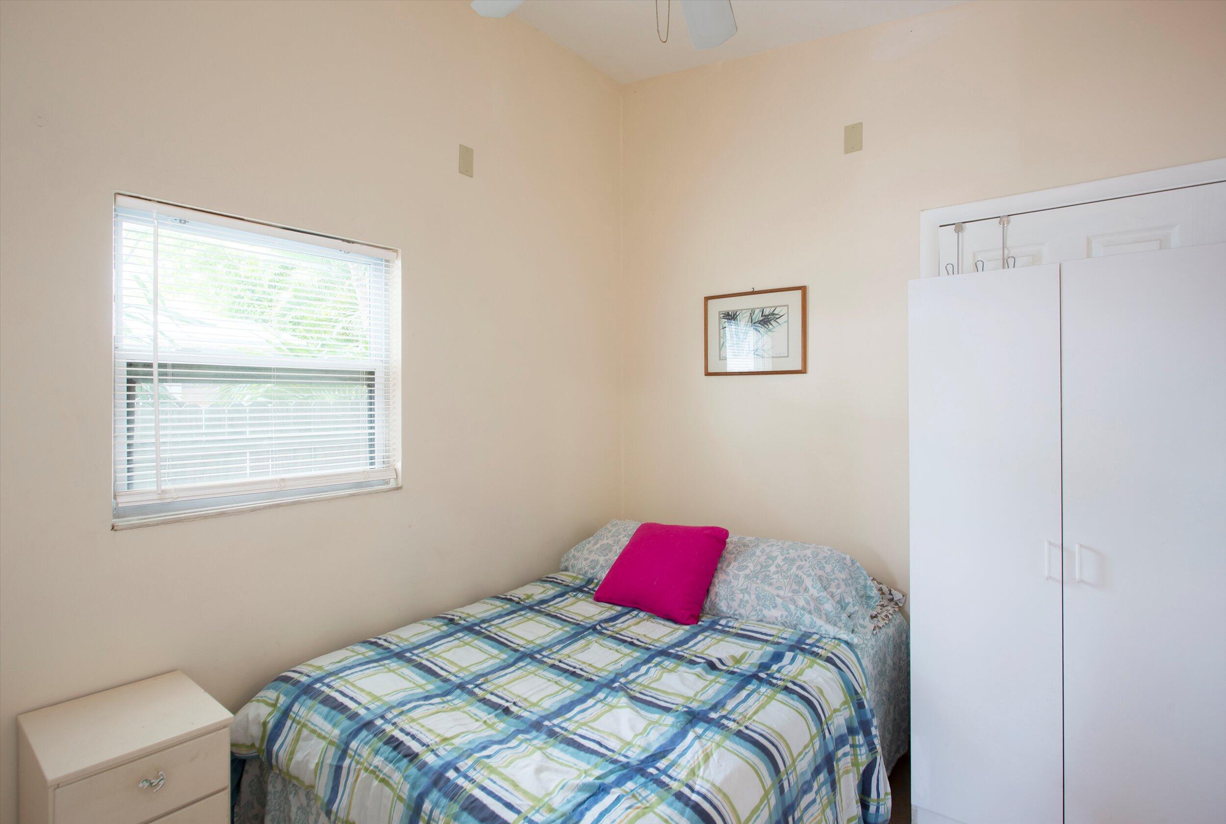 1320 6th Street Key West, FL 33040 - Photo 47 of 61 a bedroom with a bed and a window