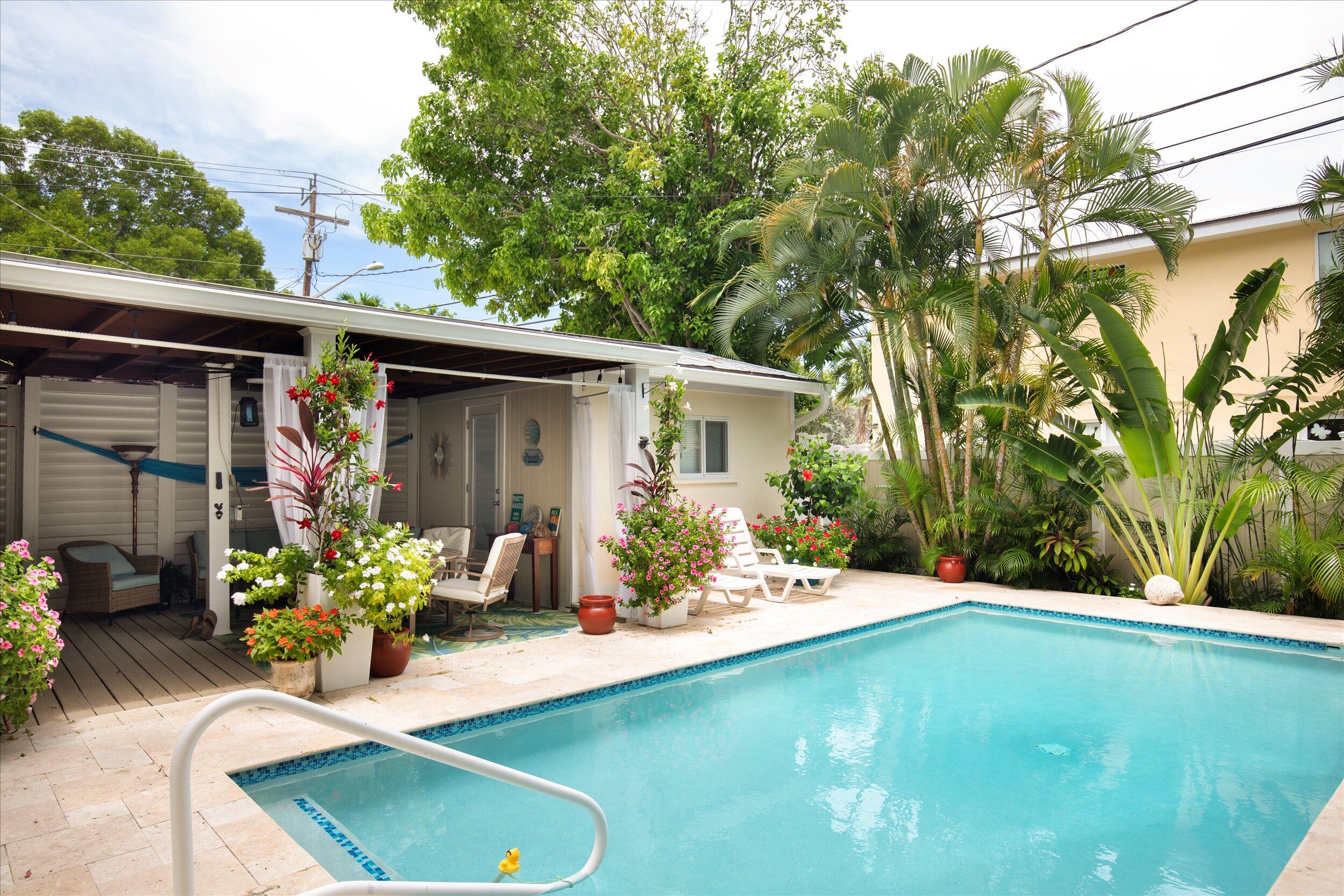 1320 6th Street Key West, FL 33040 - Photo 6 of 61 a front view of a house with patio