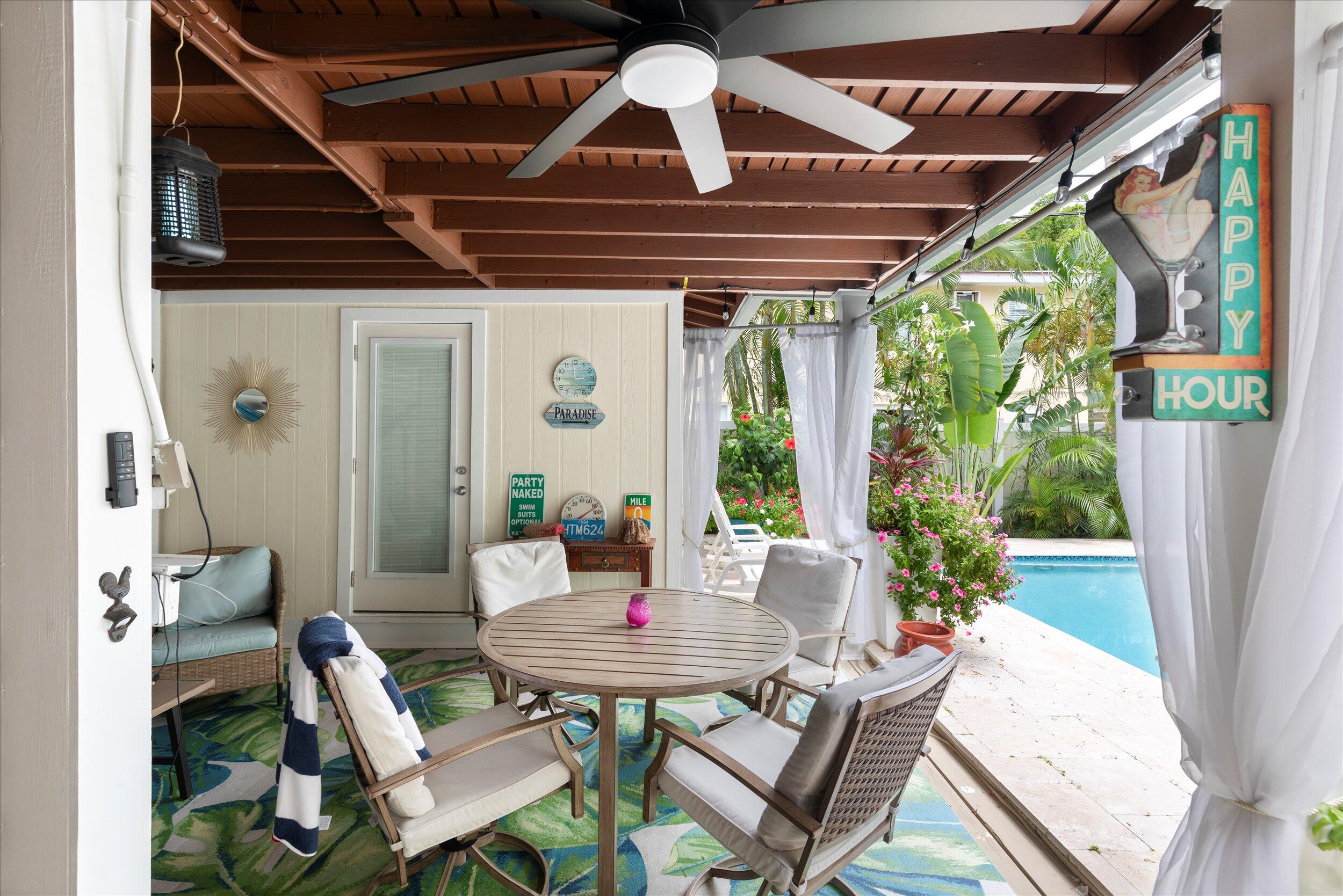 1320 6th Street Key West, FL 33040 - Photo 7 of 61 a view of a table and chairs in patio