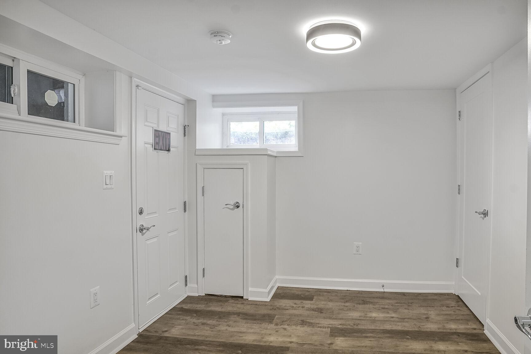 4515 Old Branch Avenue Temple Hills, MD 20748 - Photo 14 of 21 a view of an empty room with wooden floor and a window
