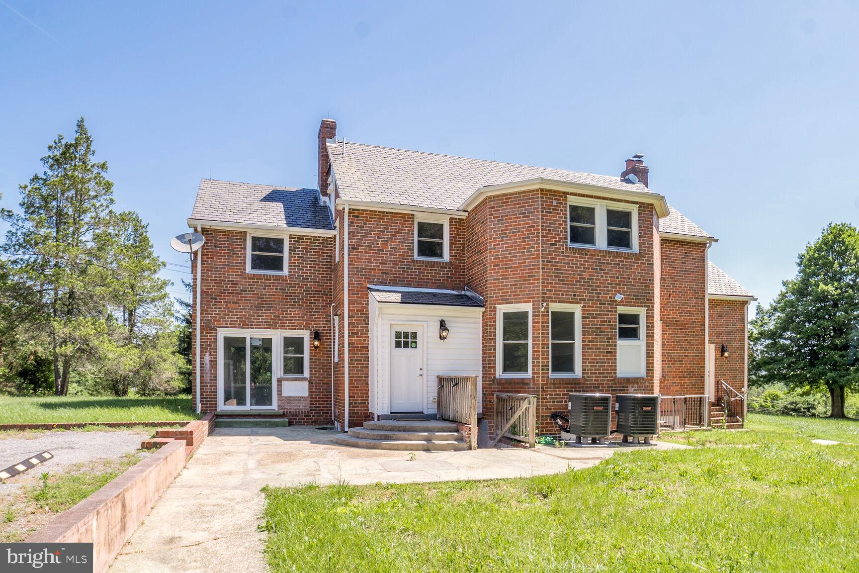 4515 Old Branch Avenue Temple Hills, MD 20748 - Photo 2 of 21 a front view of a house with a yard