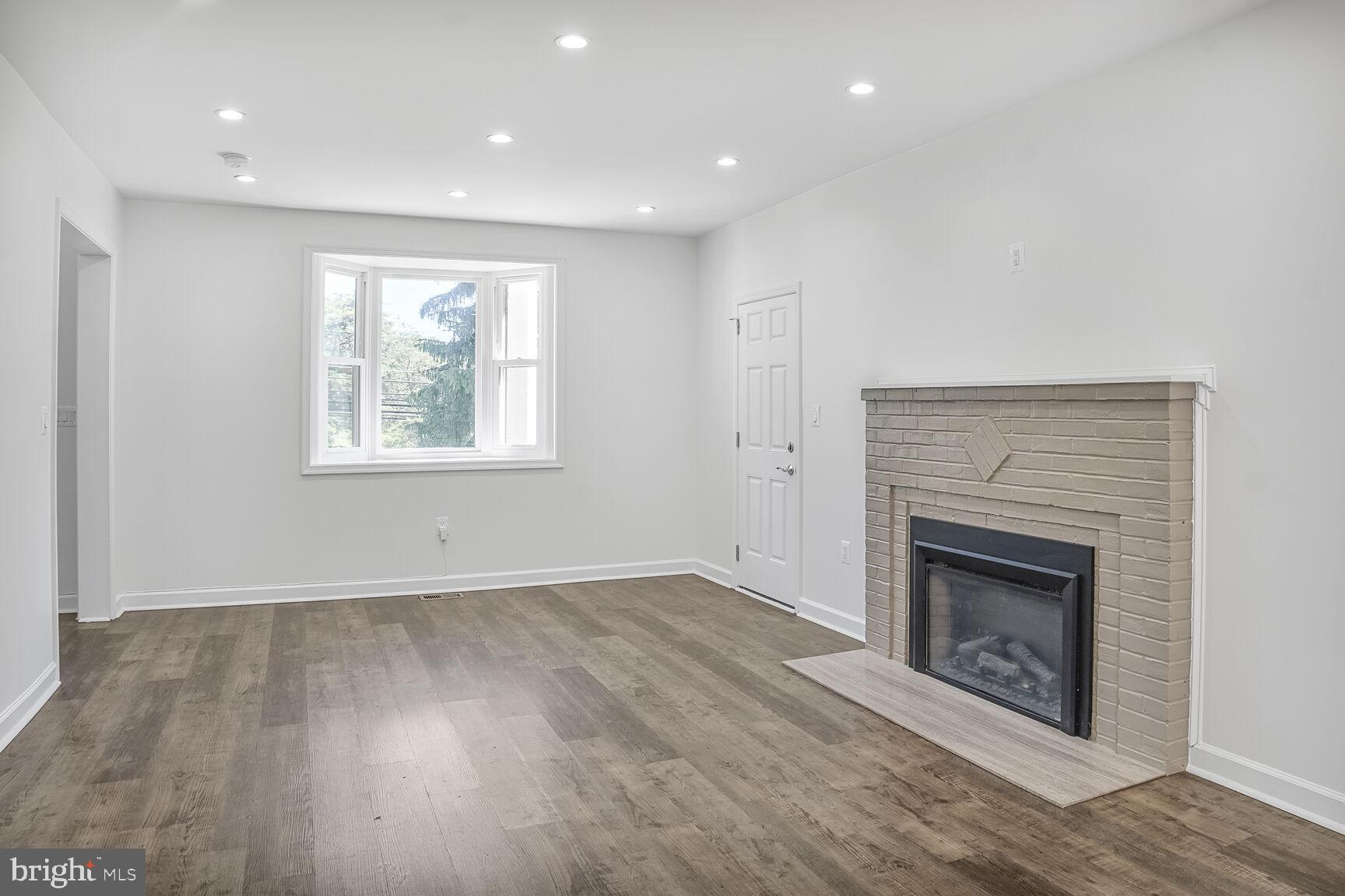 4515 Old Branch Avenue Temple Hills, MD 20748 - Photo 4 of 21 an empty room with windows and fireplace