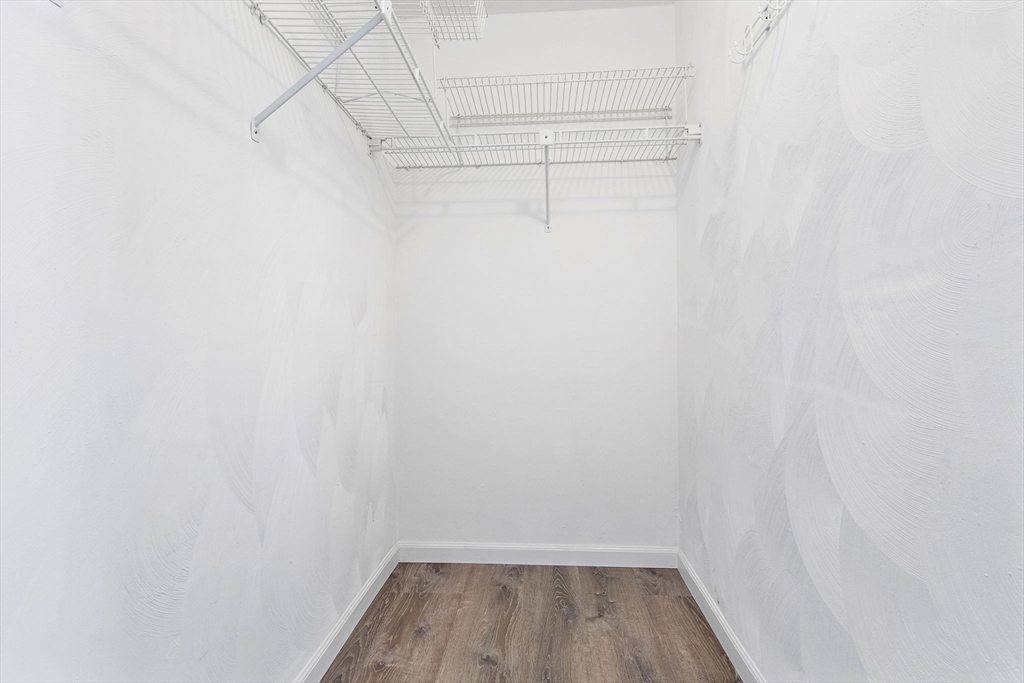 189 Littleton Road, Unit 10 Chelmsford, MA 01824 - Photo 15 of 19 a view of a room with racks on the wall