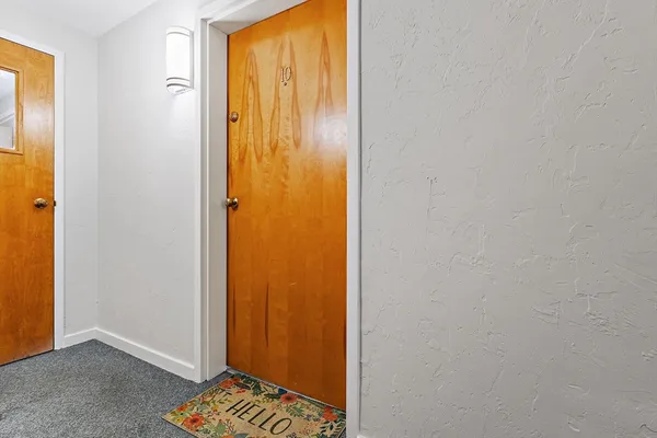 a view of bathroom with a window and a door