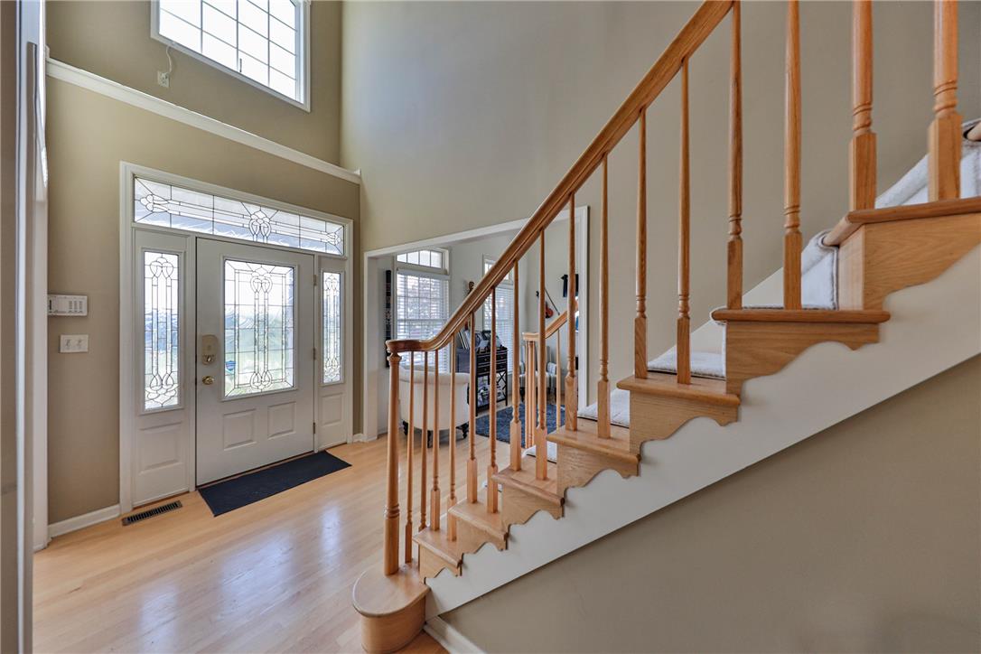 63 Long Road Lenhartsville, PA 19534 - Photo 28 of 100 A soaring entryway welcomes guests with warm wood flooring and a classic wood staircase.
