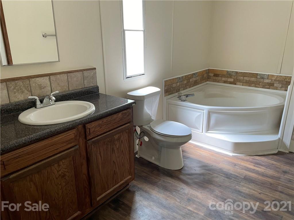 4794 Blade Run Road Edgemoor, SC 29712 - Photo 16 of 20 a bathroom with a sink and a mirror