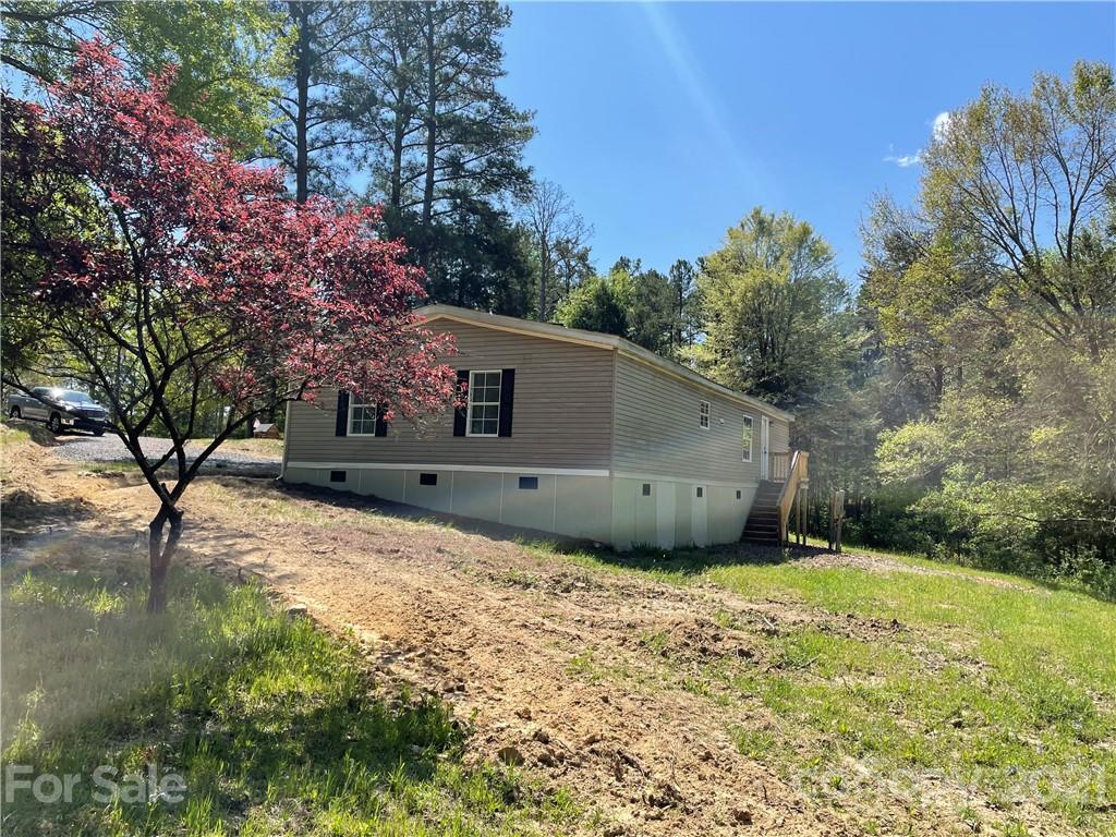 4794 Blade Run Road Edgemoor, SC 29712 - Photo 4 of 20 a backyard of a house with lots of green space