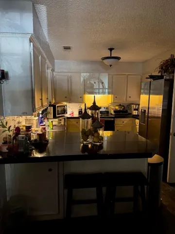 a view of a dining room with furniture