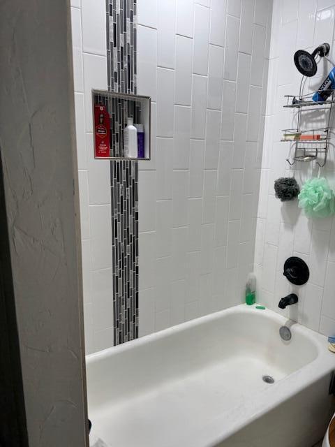 4806 76th Street Lubbock, TX 79424 - Photo 7 of 11 a bathroom with a bathtub and shower