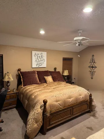 a bedroom with bed and window