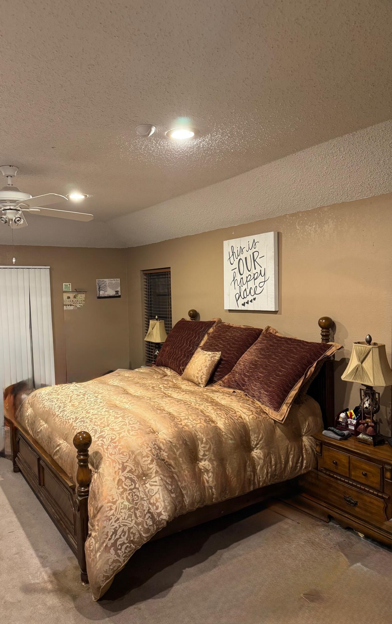 4806 76th Street Lubbock, TX 79424 - Photo 9 of 11 a bedroom with a bed and a dresser