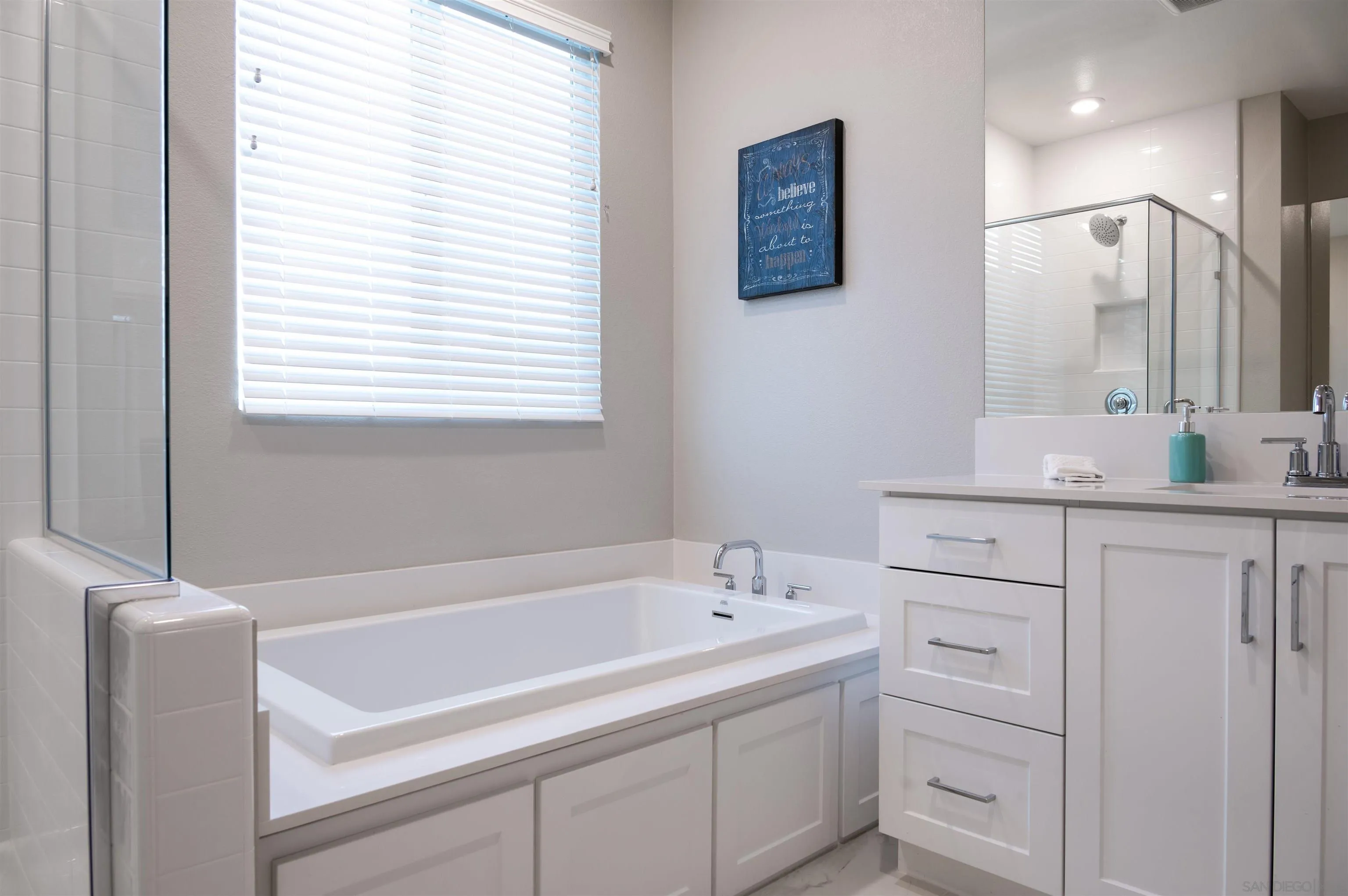 1790 Whitmore Loop Chula Vista, CA 91913 - Photo 14 of 28 a bathroom with a bathtub and a sink