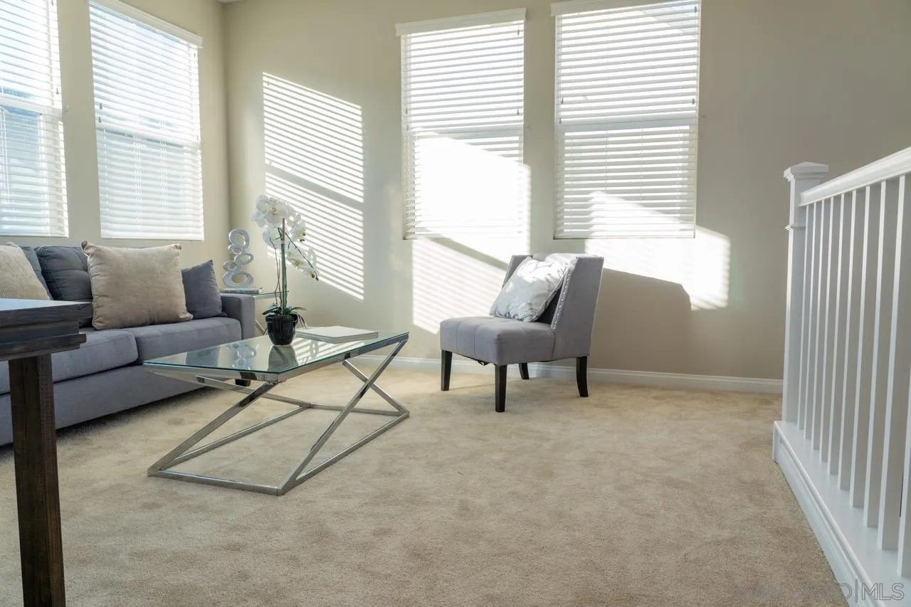 1790 Whitmore Loop Chula Vista, CA 91913 - Photo 19 of 28 a living room with furniture and a large window