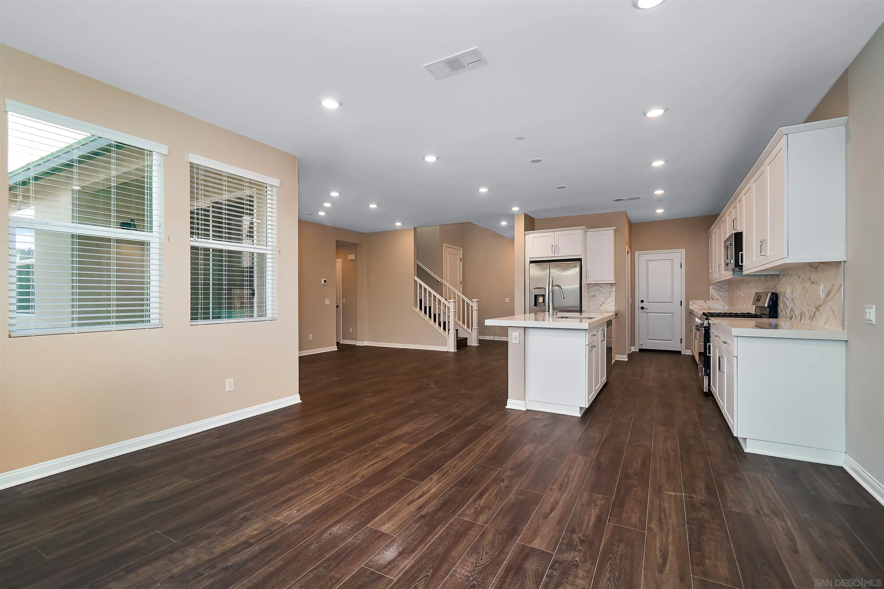 1790 Whitmore Loop Chula Vista, CA 91913 - Photo 21 of 28 a view of kitchen with wooden floor and electronic appliances