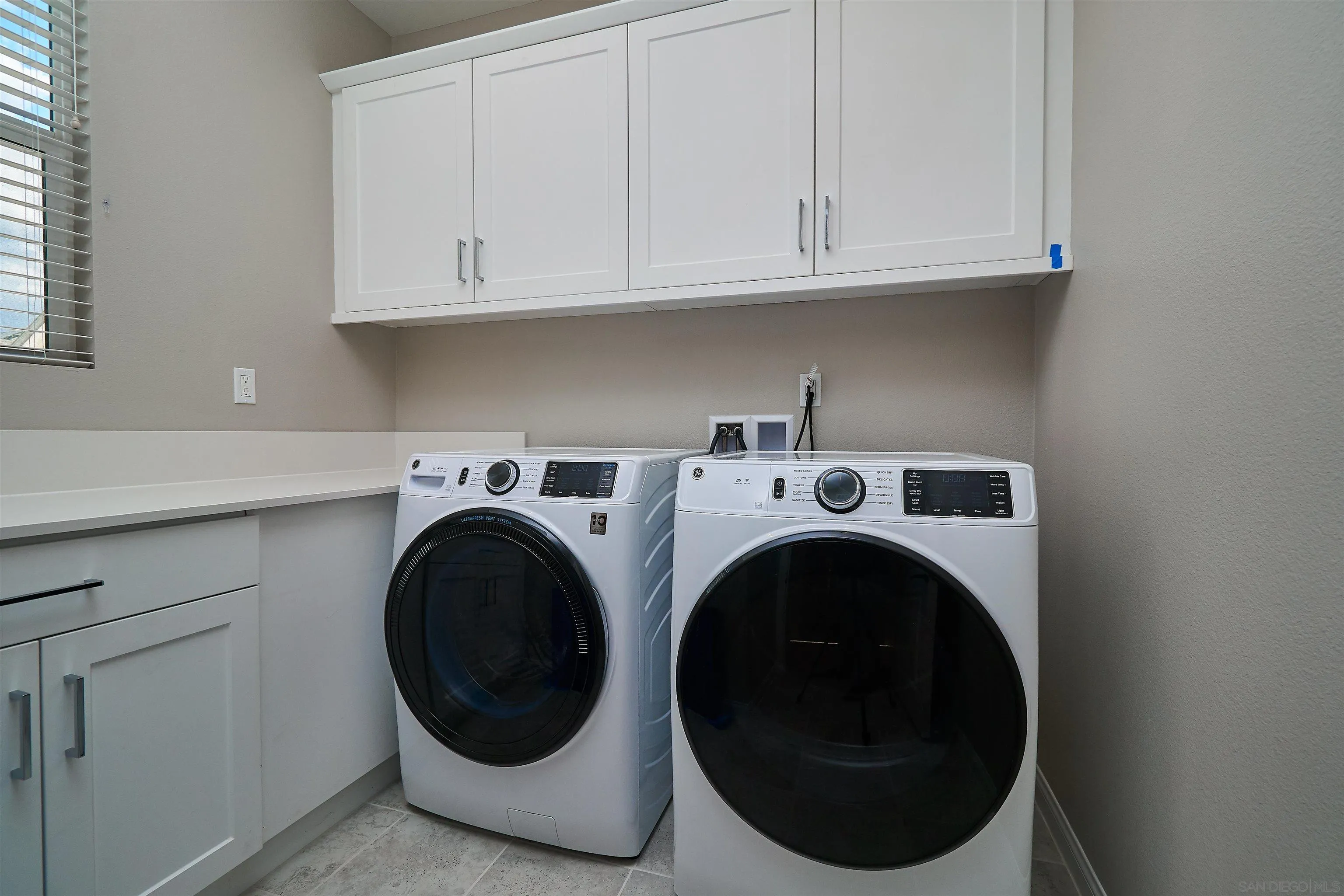 1790 Whitmore Loop Chula Vista, CA 91913 - Photo 26 of 28 a utility room with dryer and washer