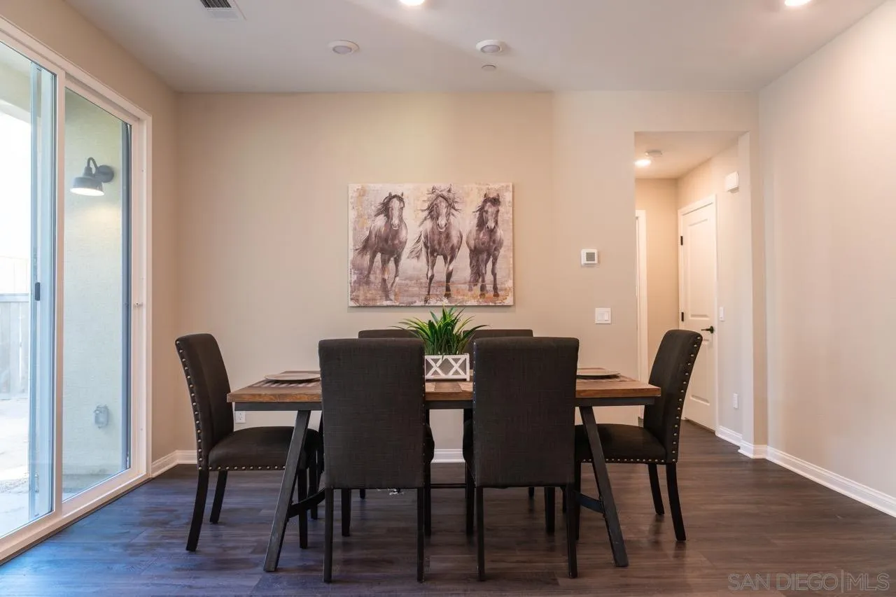 1790 Whitmore Loop Chula Vista, CA 91913 - Photo 8 of 28 a view of a dining room with furniture and wooden floor