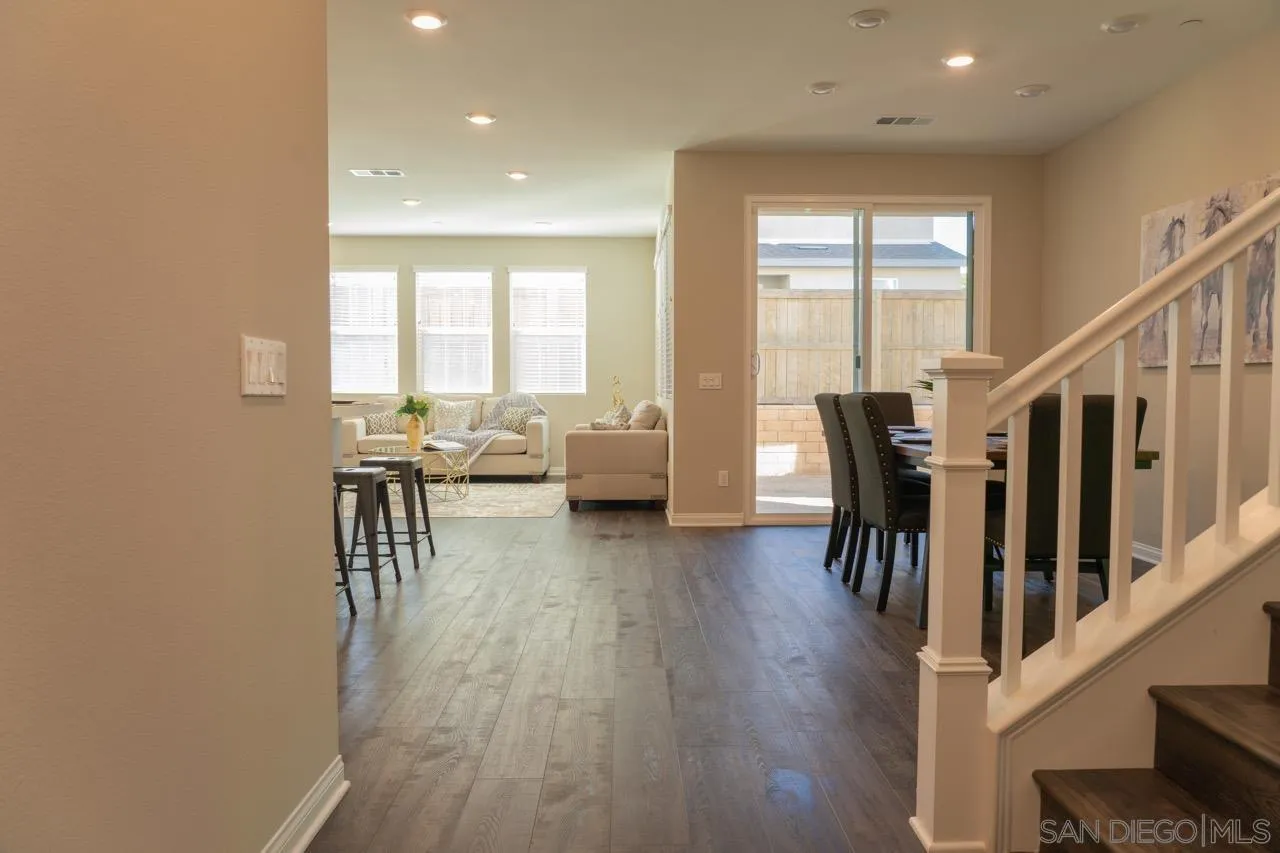 1790 Whitmore Loop Chula Vista, CA 91913 - Photo 9 of 28 a living room with furniture and a table with wooden floor