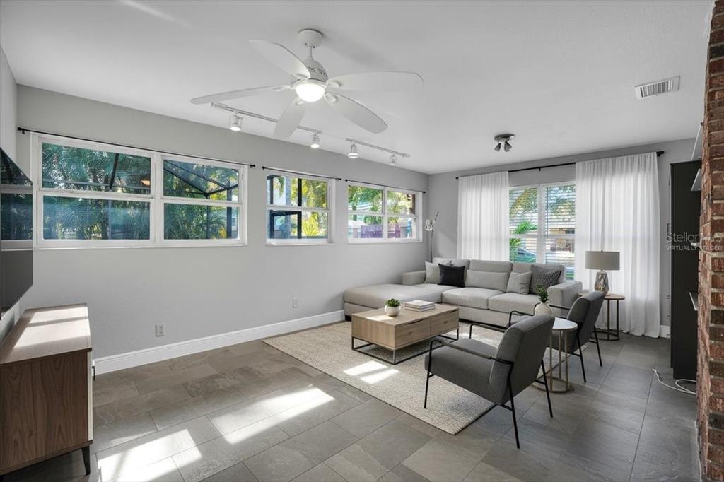 2814 47th Street South Gulfport, FL 33711 - Photo 12 of 57 a living room with furniture and a large window