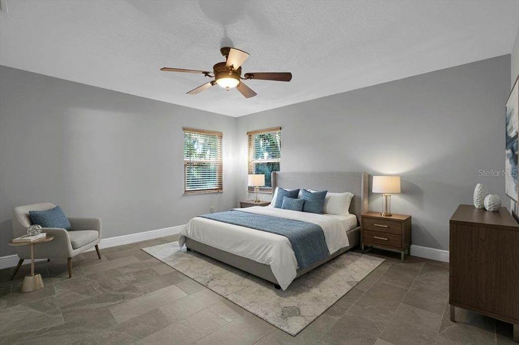 2814 47th Street South Gulfport, FL 33711 - Photo 13 of 57 a bedroom with a bed and a chandelier