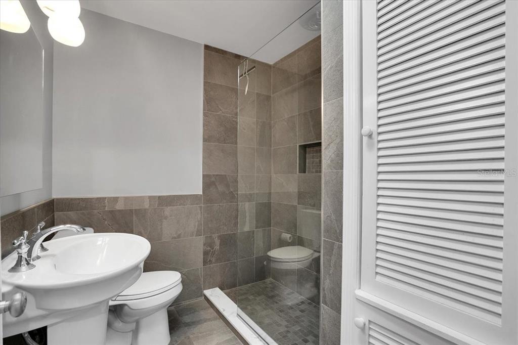 2814 47th Street South Gulfport, FL 33711 - Photo 14 of 57 a bathroom with a sink a toilet and shower